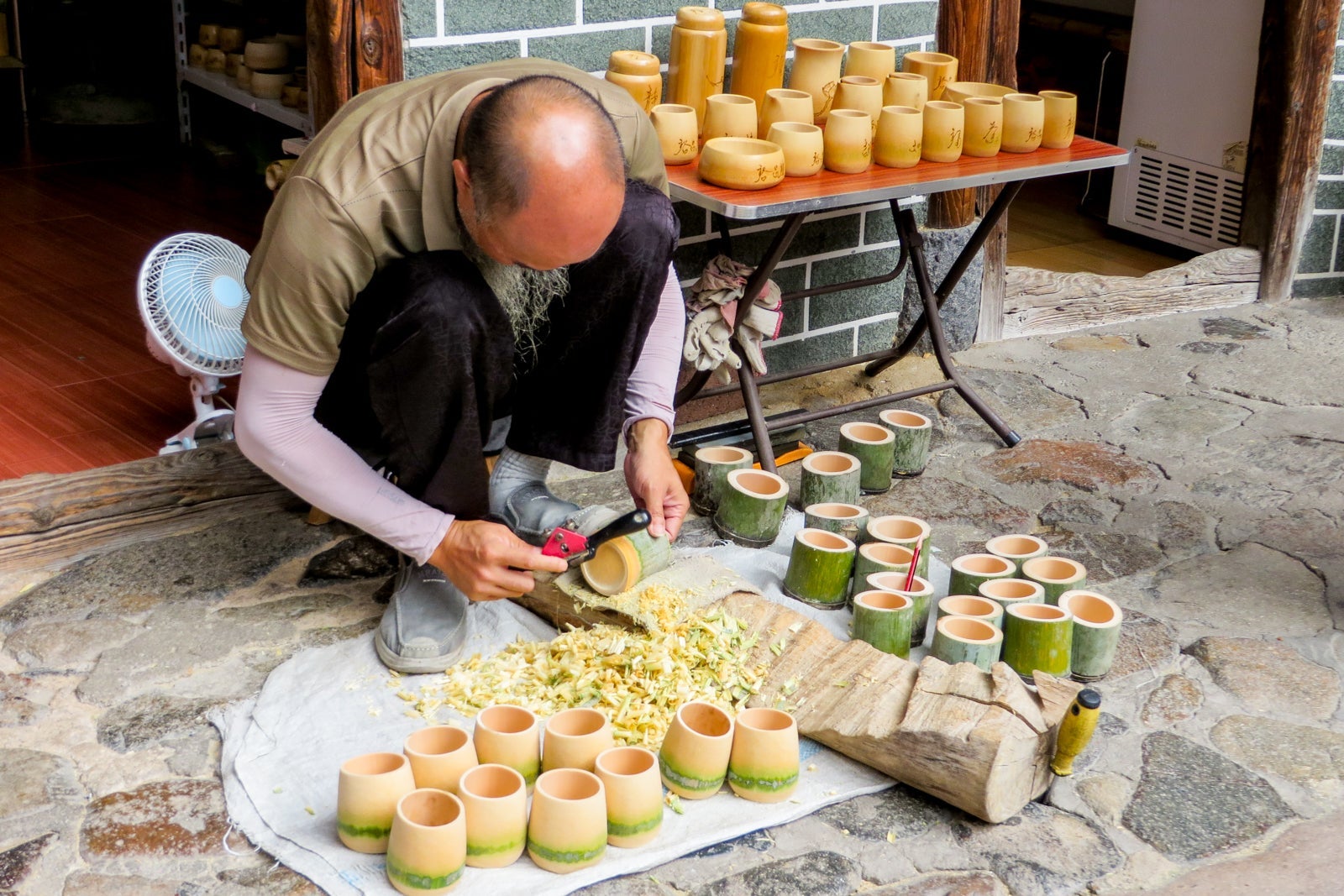 A man sells local Chinese handicrafts