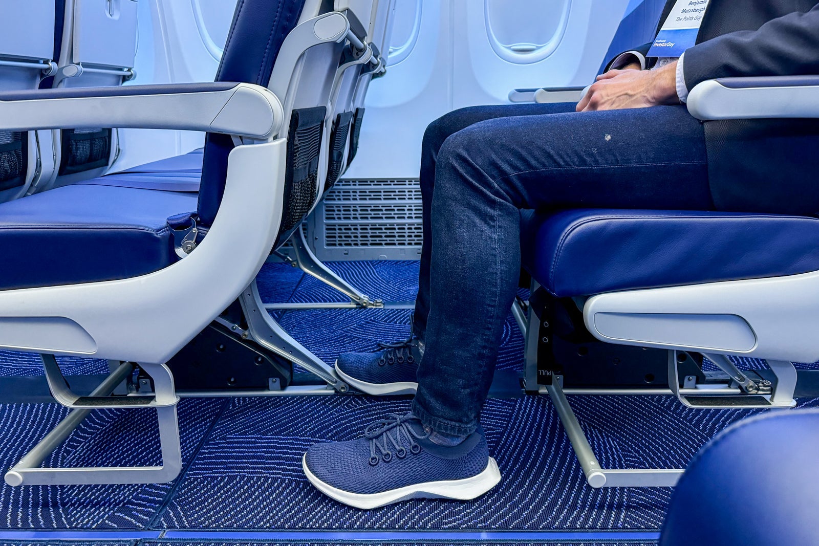 a reporter sitting in a Southwest Airlines extra-legroom seat