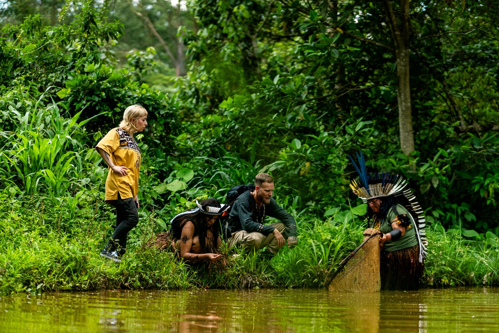 Indigenous person from the Wassú tribe demonstrating a fishing trap during an outdoor tourist expedition in Brazil