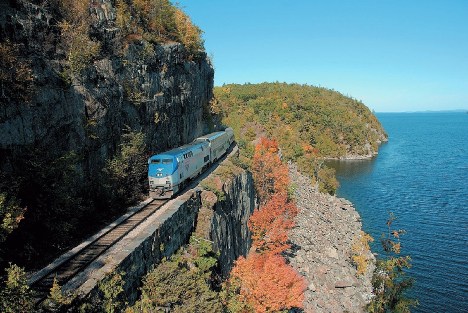 Amtrak train traveling through the Adirondack Mountains in upstate New York
