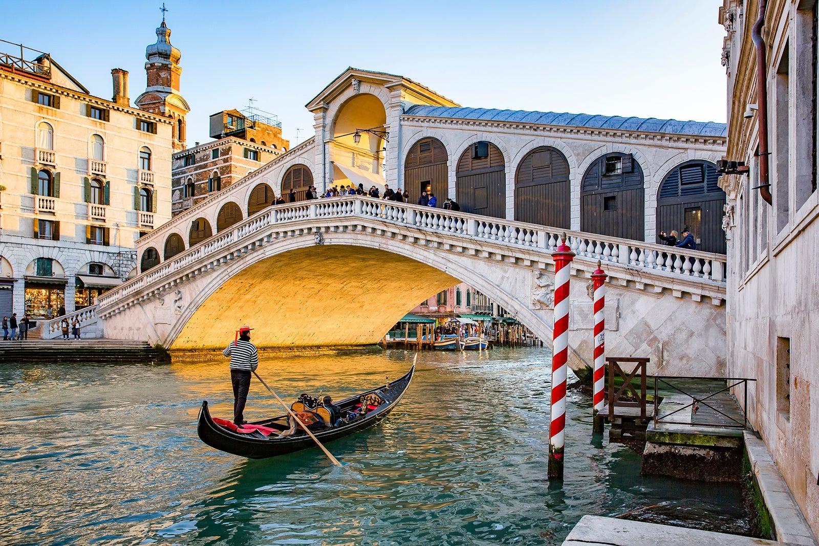 Gondola on Grand Canal in front of Rialto Bridge in Venice