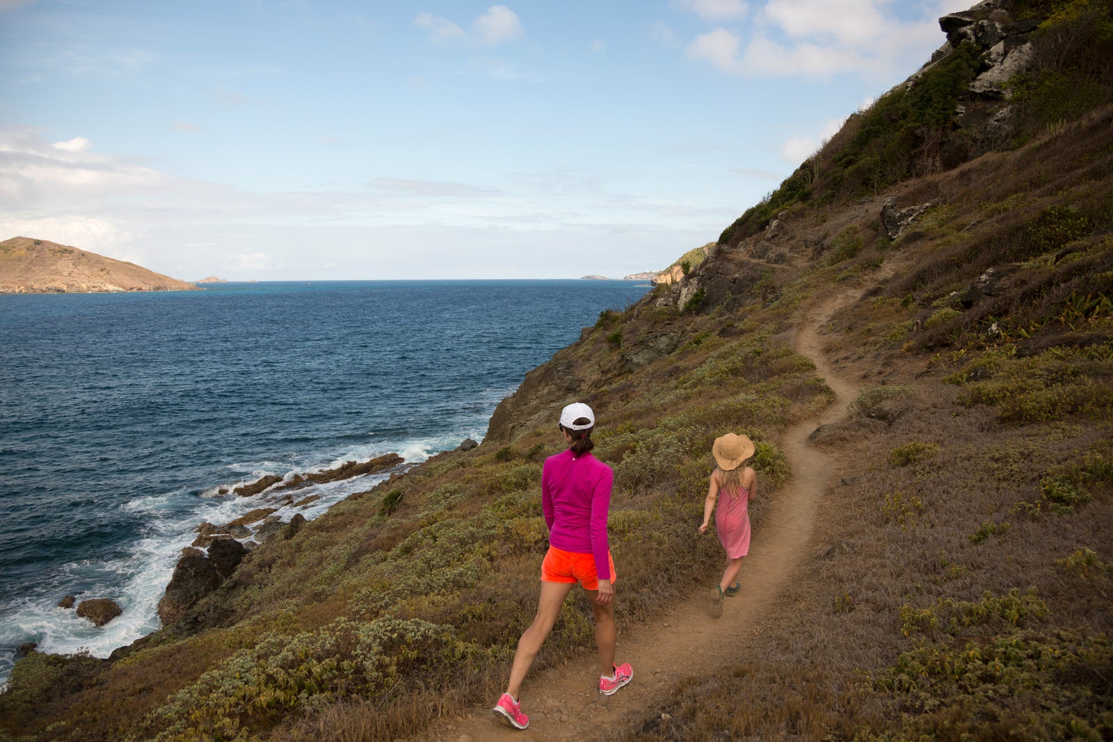 Mother and daughter hiking in St.Barts, French West Indies.