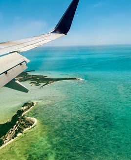 Airplane over water