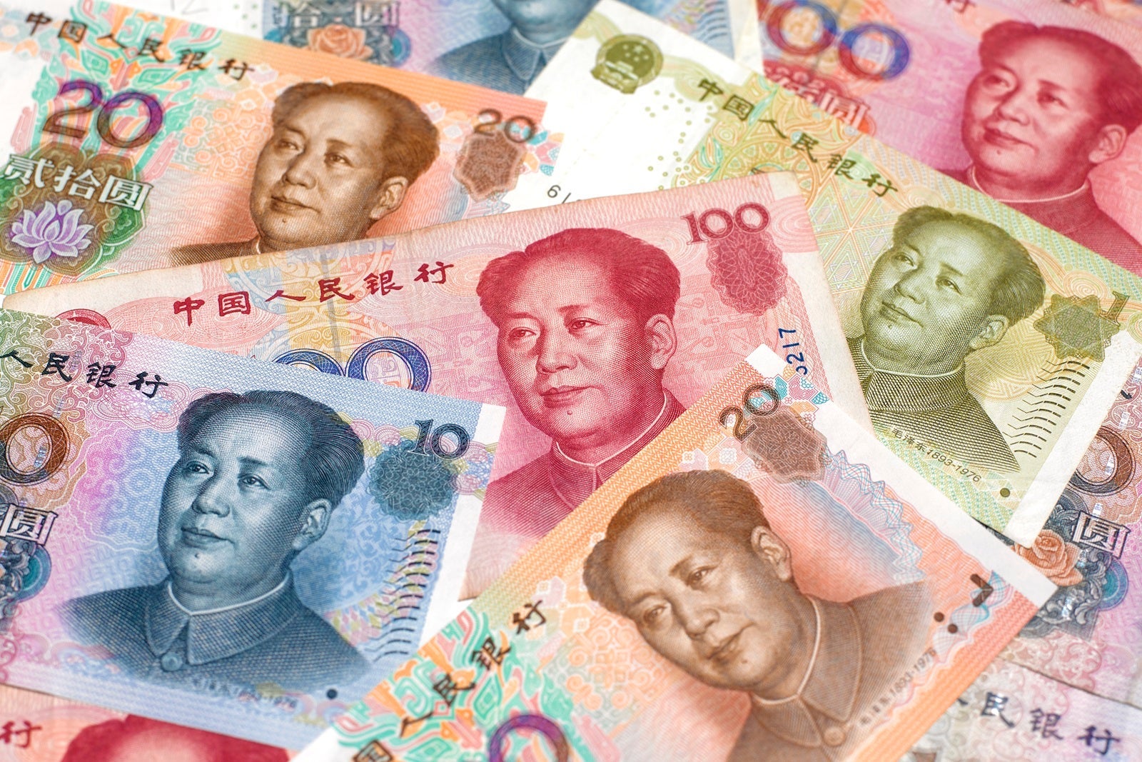 A close up of Chinese yuan in several denominations and colors