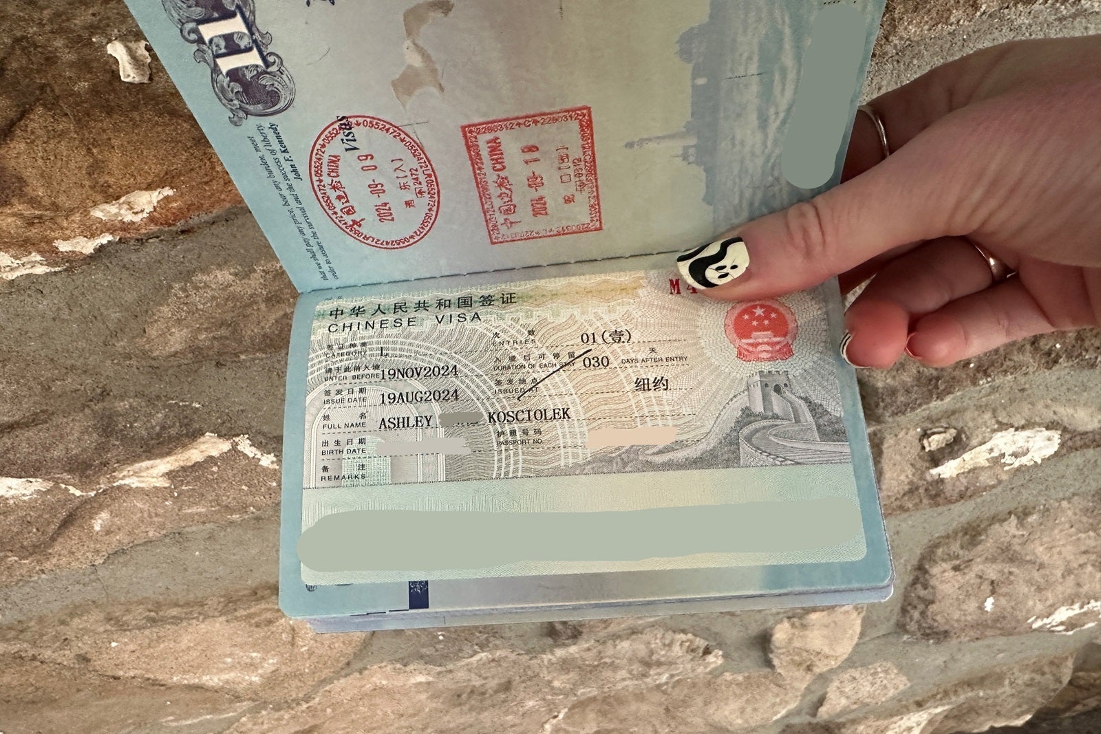 A Chinese single-entry visa affixed to a passport page