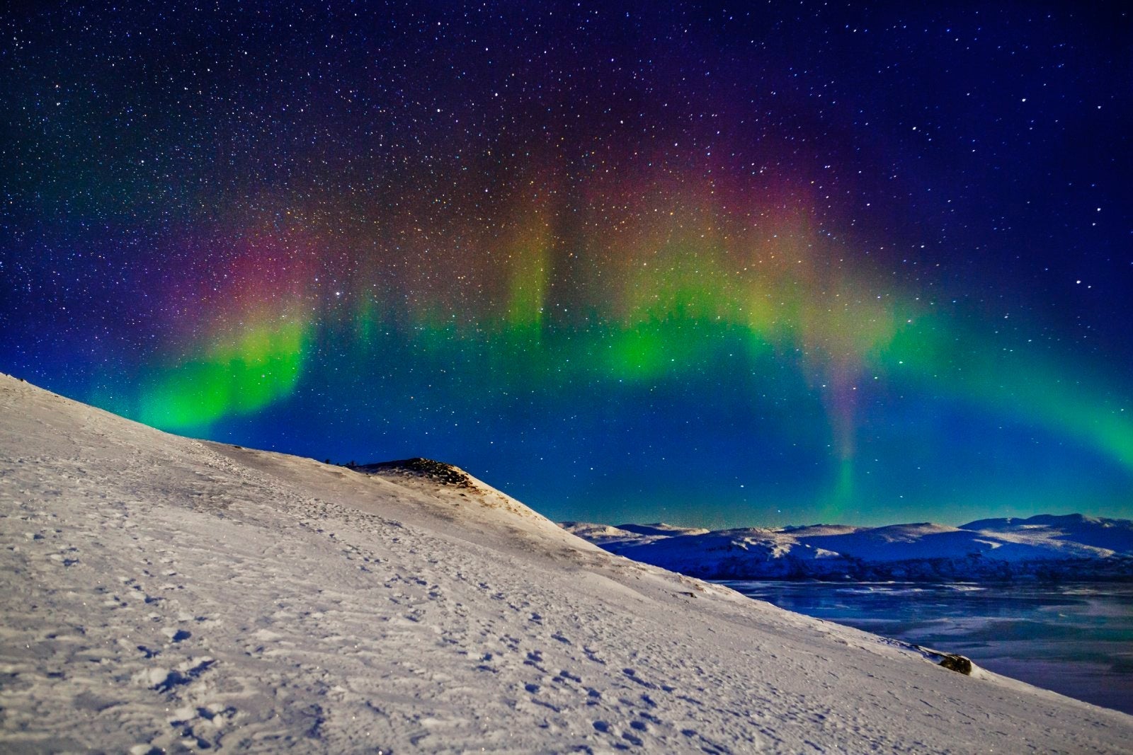 Aurora Borealis or Northern Lights in full color seen from the Abisko Sky Station, Abisko , Lapland, Sweden. Cold temperatures as low as -47 celsius