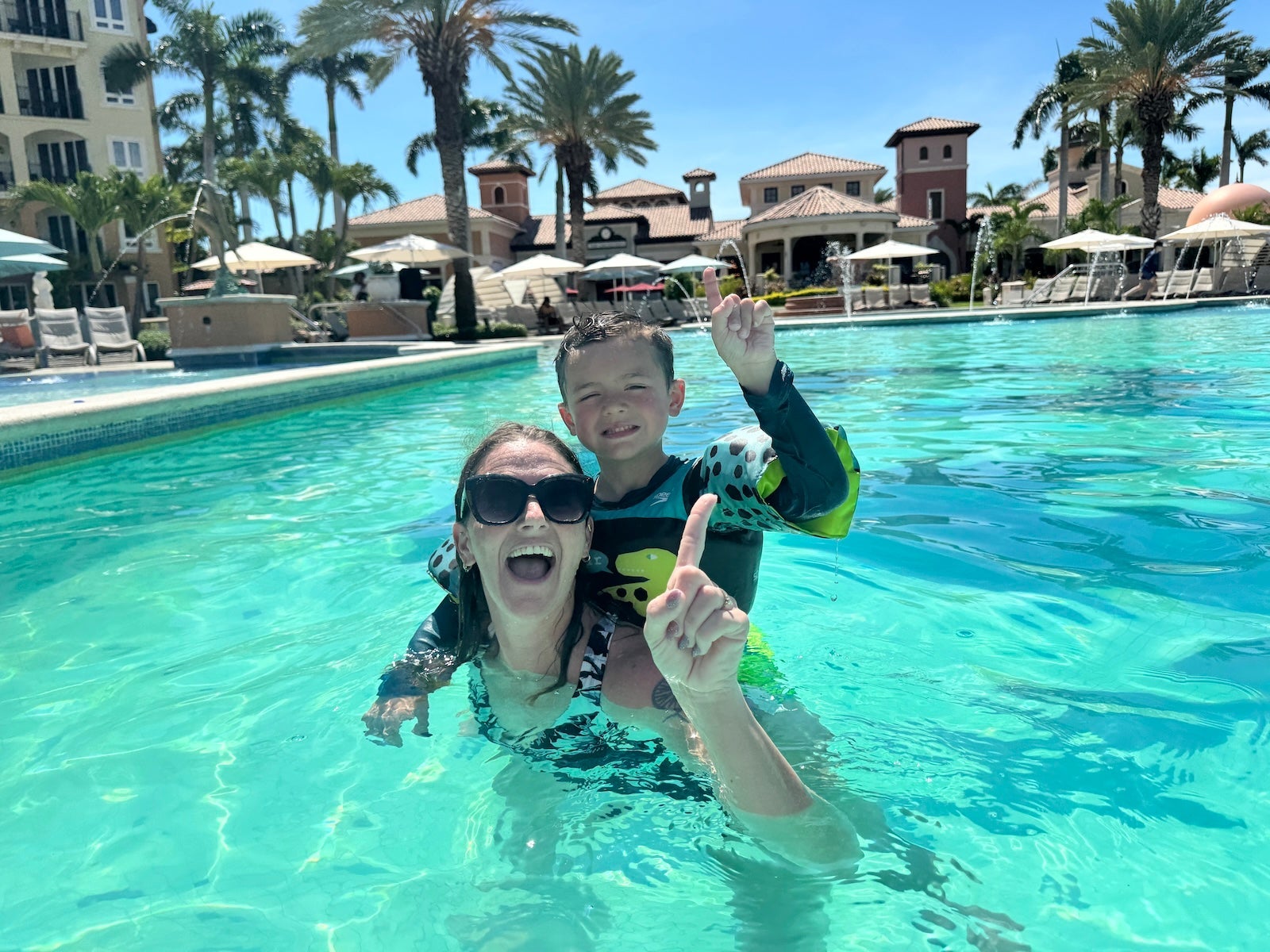 Mother and son in pool