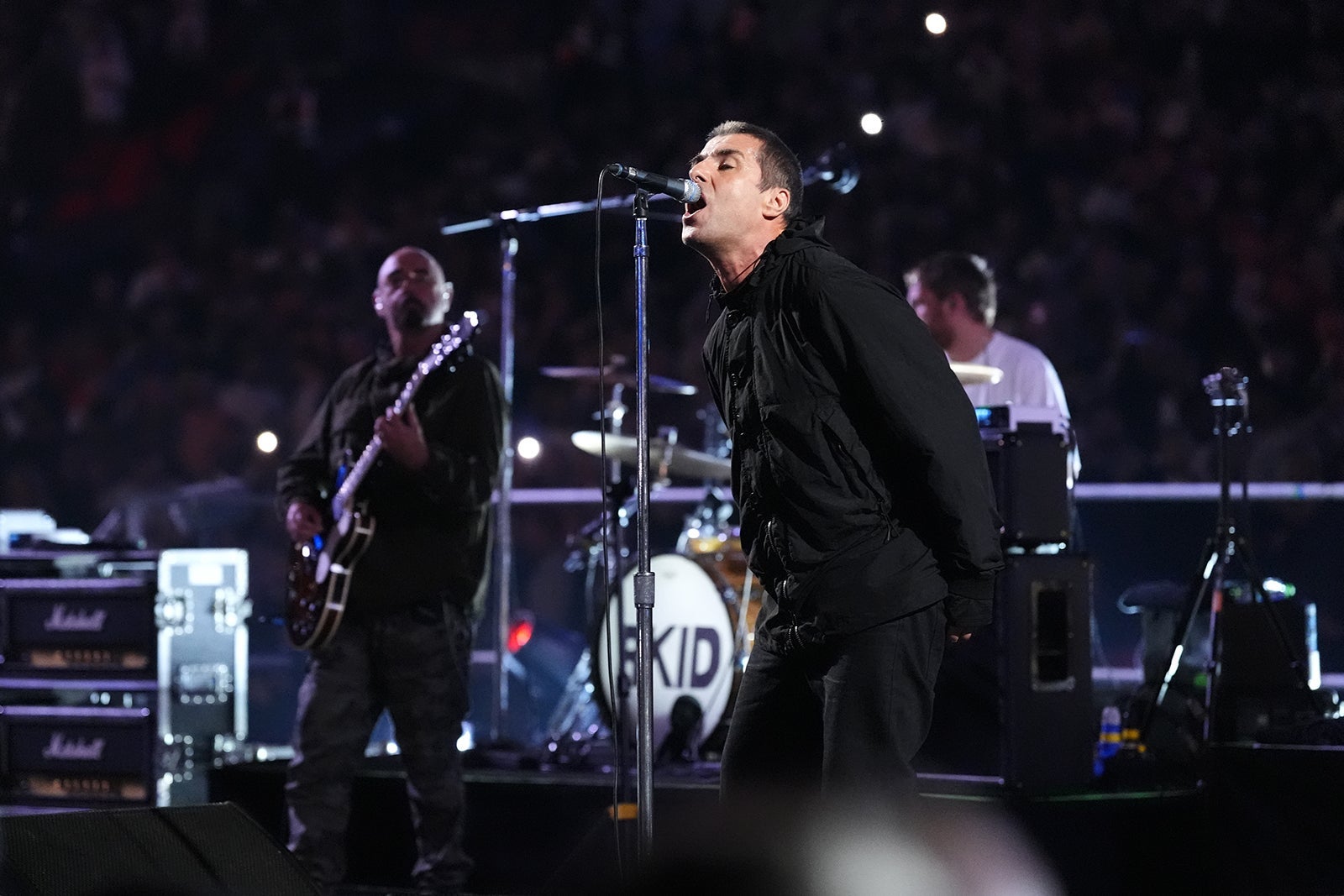 Liam Gallagher of Oasis performing at Wembley Stadium, London.