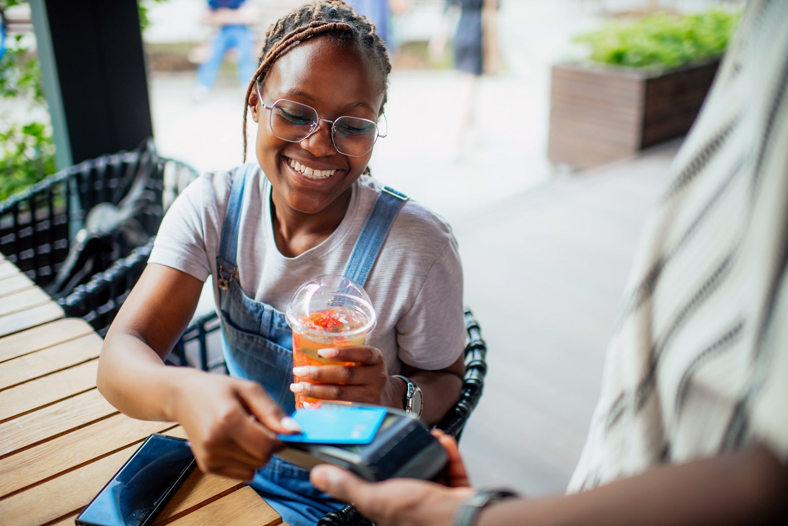 Woman using a credit card to pay
