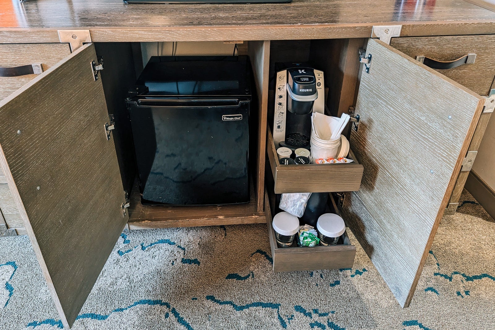 Minifridge and Keurig coffeemaker in hotel room