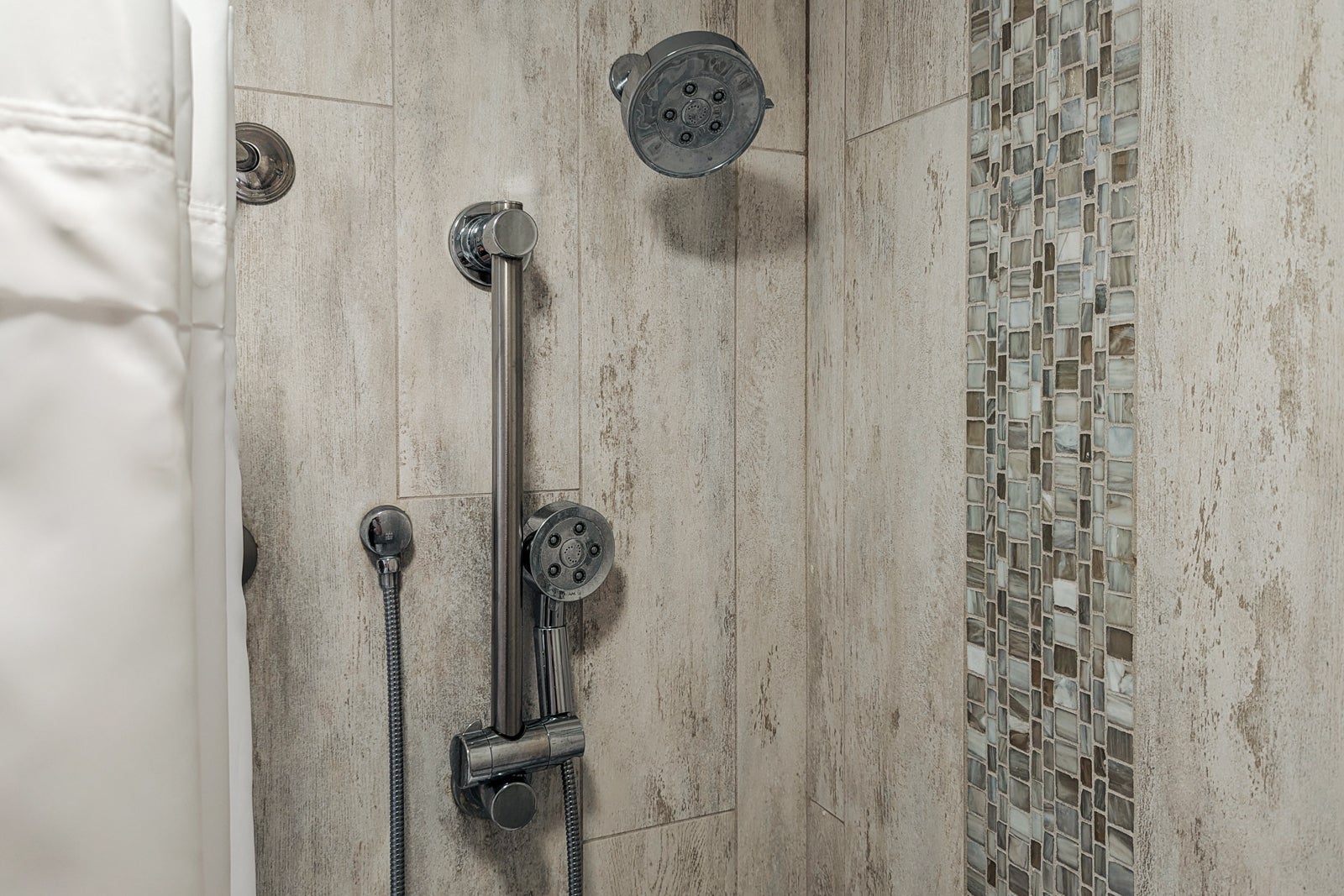 two showerheads in hotel bathroom