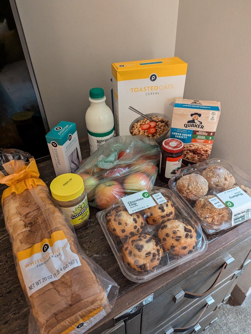Arrangements of groceries including muffins, bread and cereal