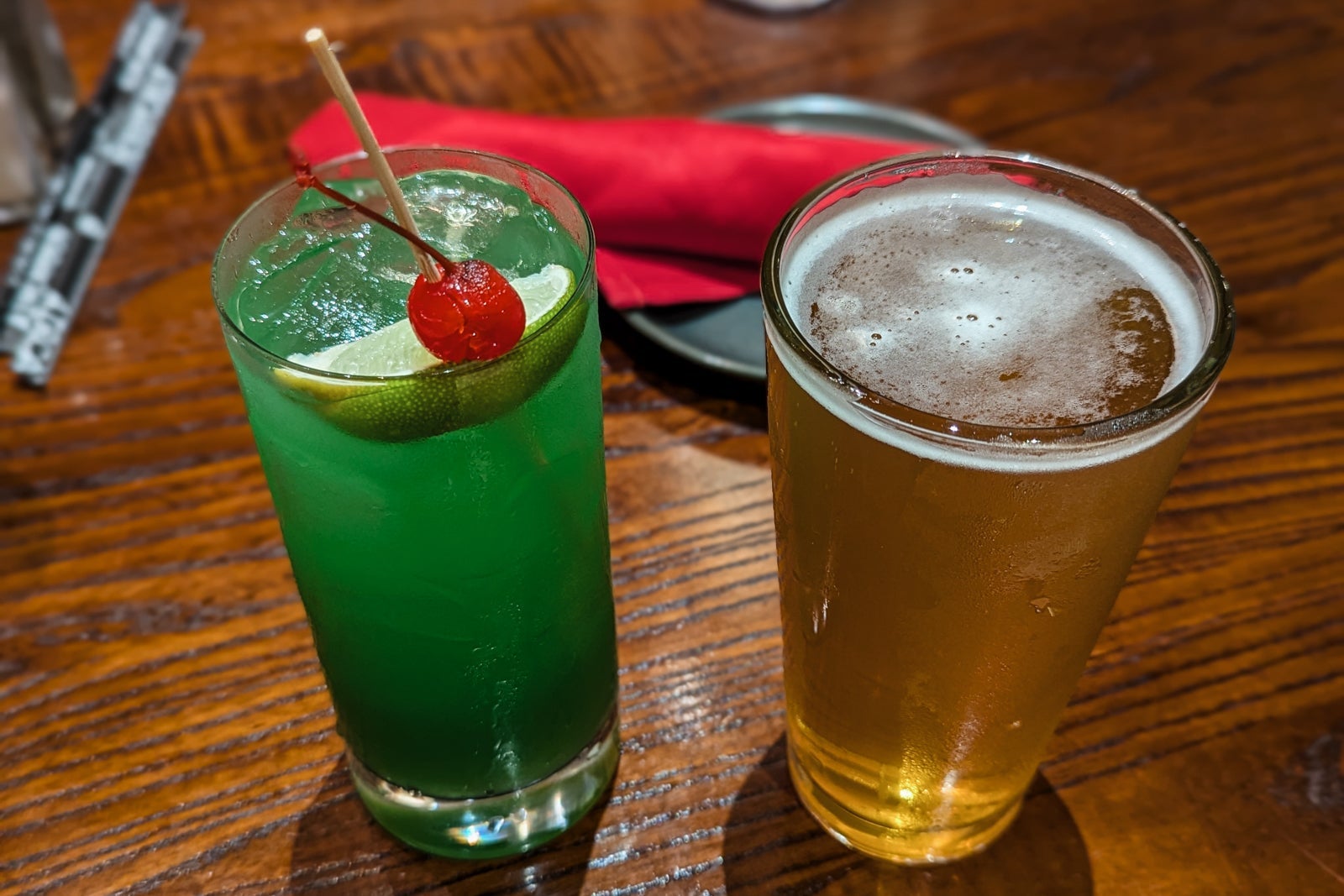 Blue-green cocktail and beer
