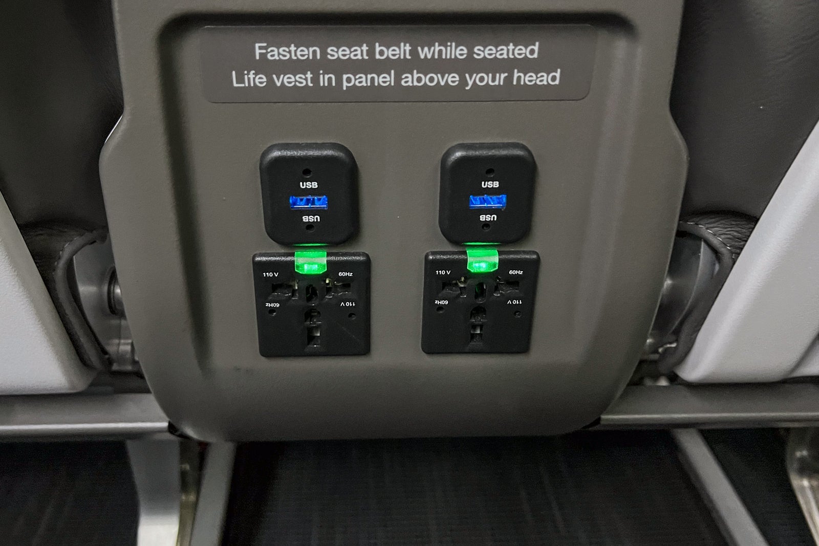Electrical outlets on an Alaska Airlines plane.