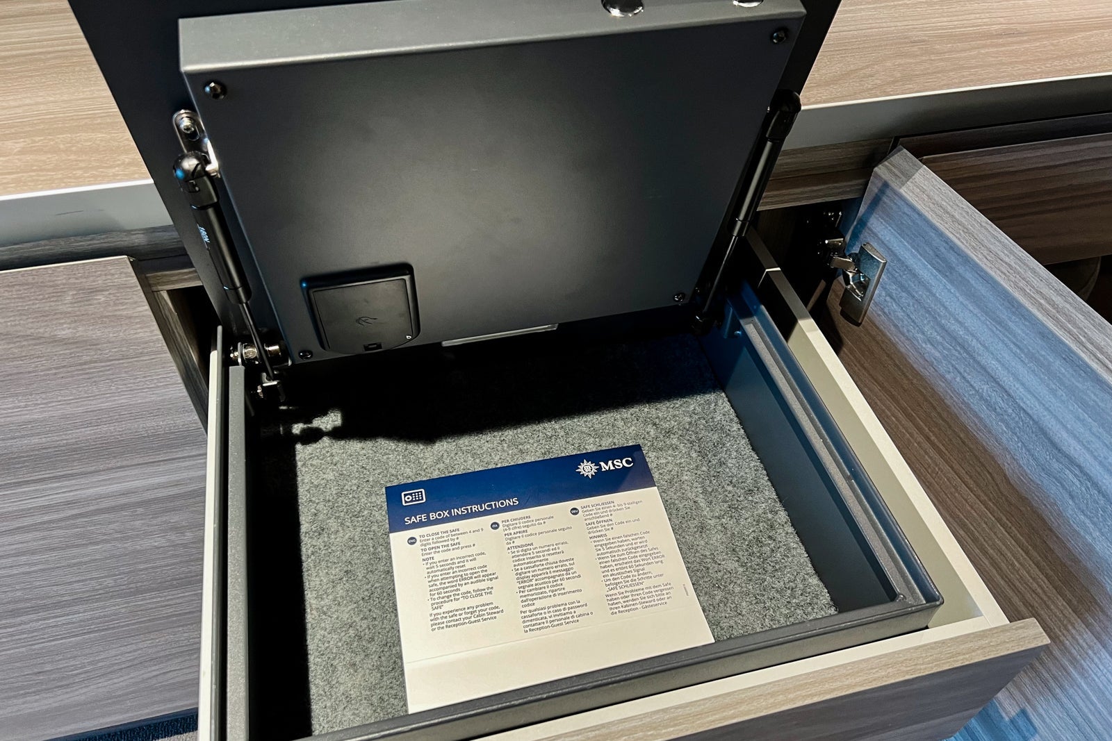 A pull-out safe in a Yacht Club Deluxe Suite on MSC World Europa