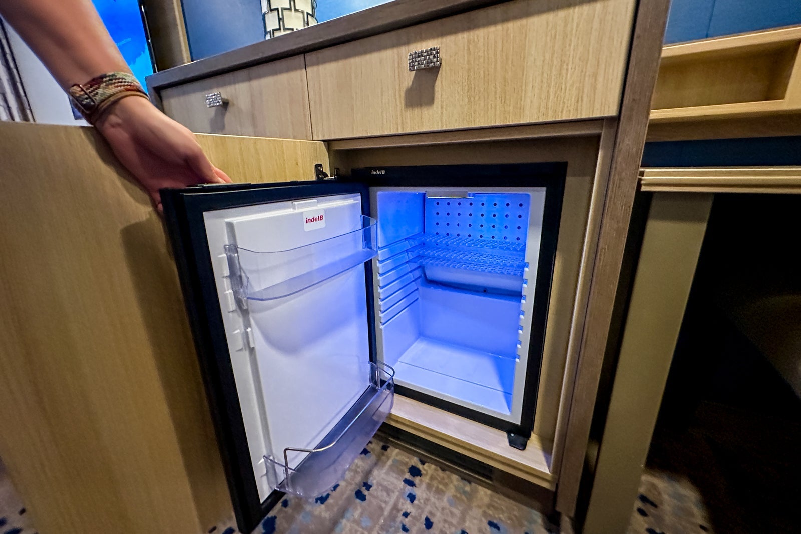 The inside of a mini-fridge in a cruise ship cabin