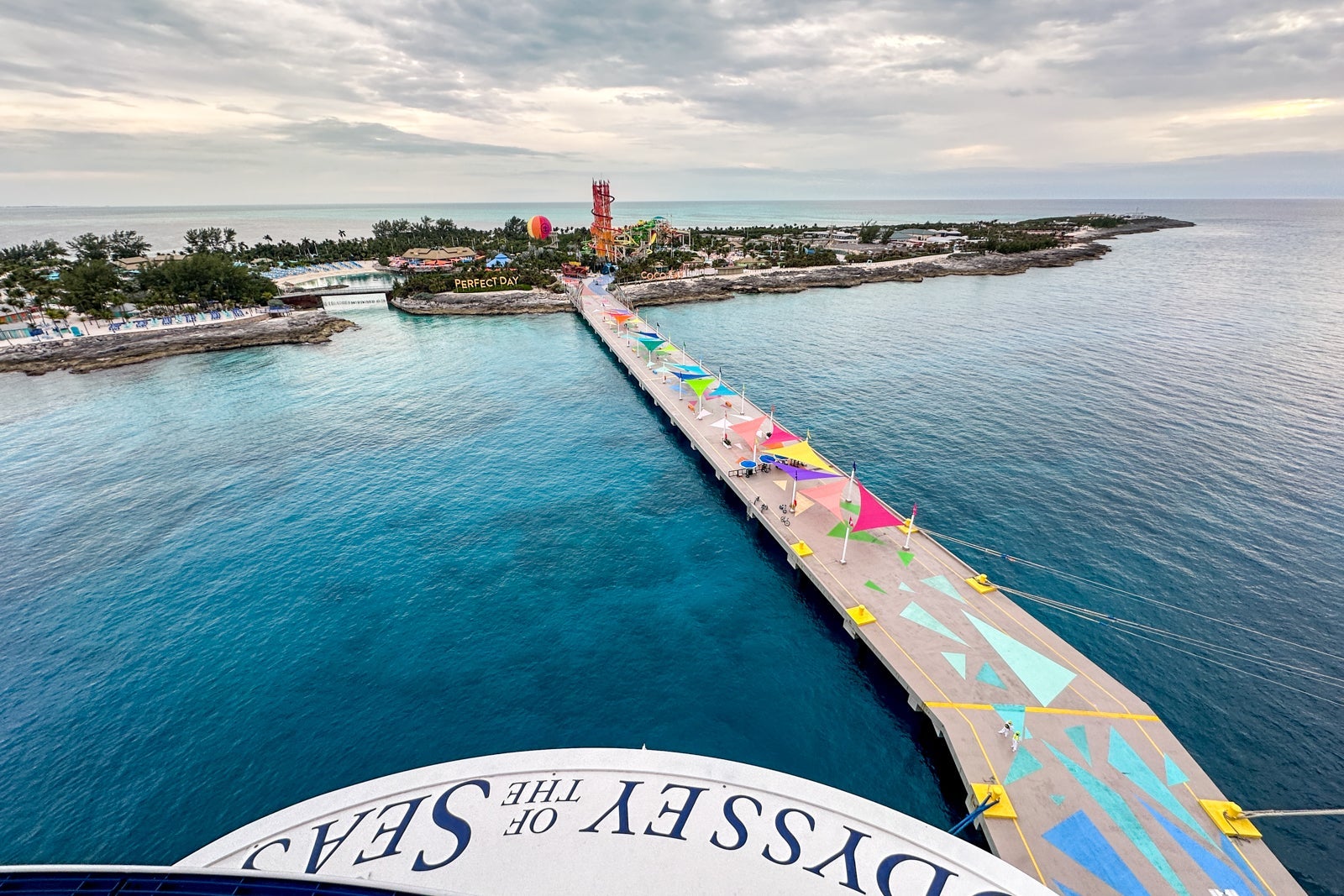 A view from the aft of a cruise ship overlooking a cruise line's private island