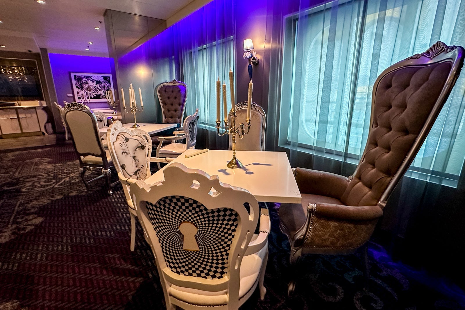 The inside of an "Alice in Wonderland" themed restaurant on a cruise ship