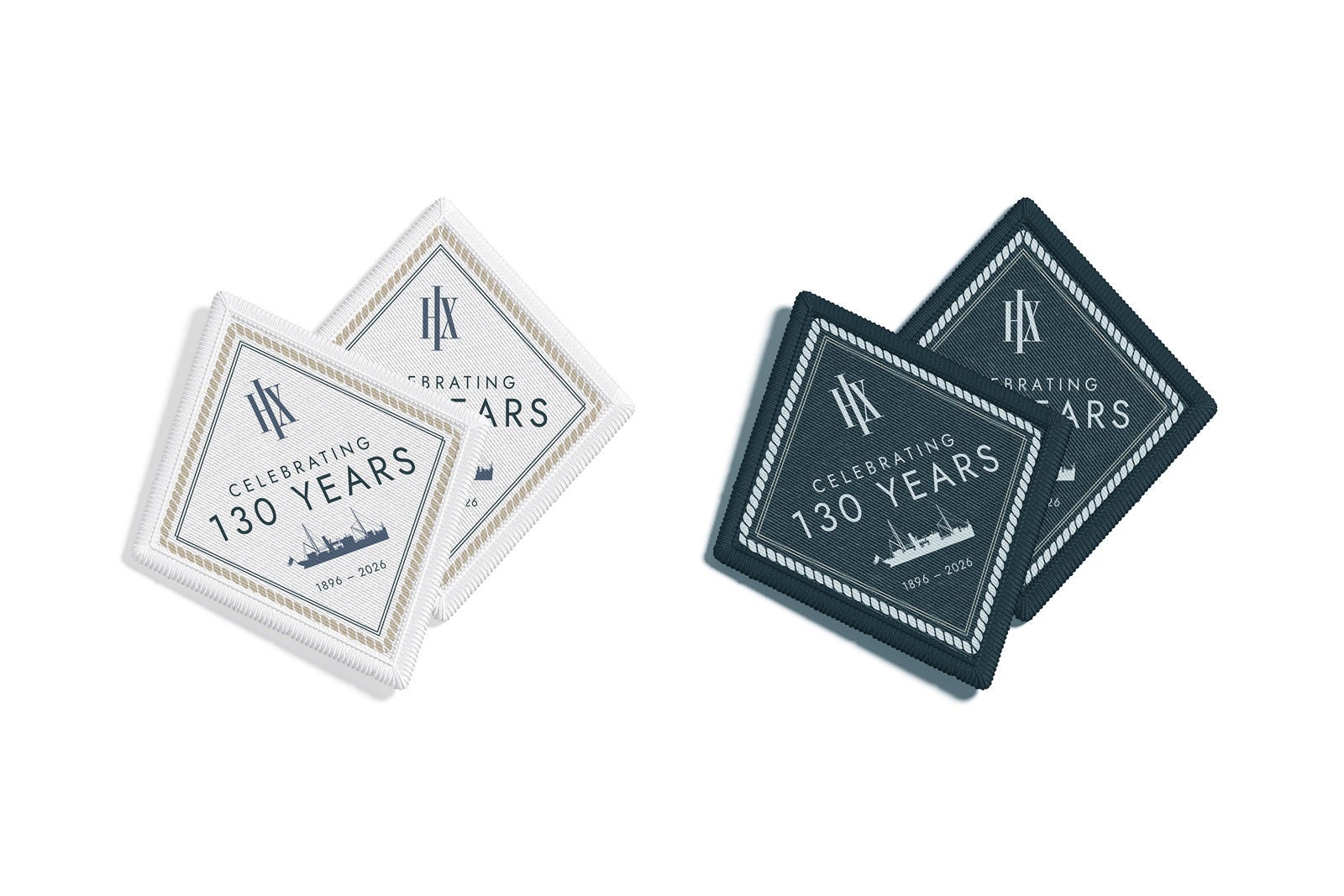 Two sets of diamond-shaped commemorative patches, one white and one blue, set on a white background