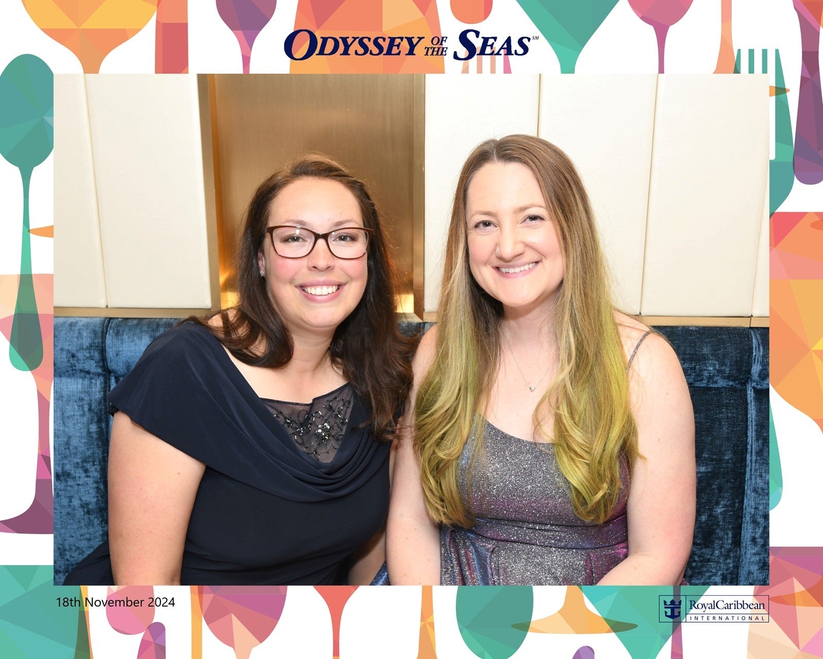 Two women seated side by side at dinner with a cheesy border around it