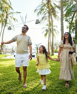 Family walking at a hotel garden