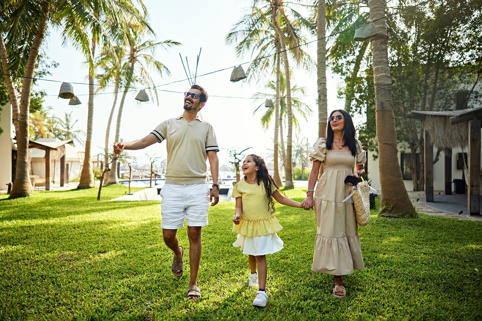 Family walking at a hotel garden