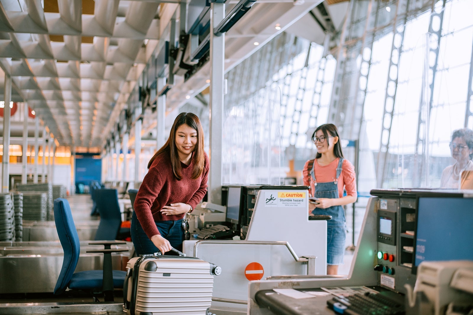 Asian teenager girl at the airport check-in counter
