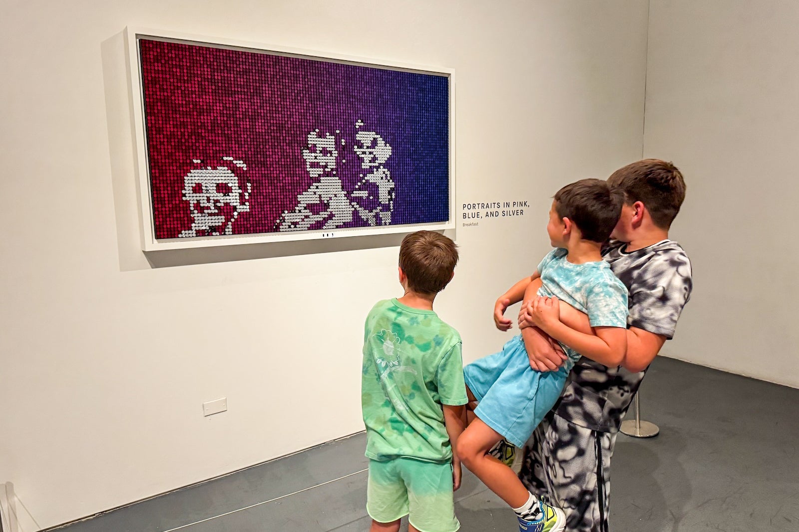 Boys looking at museum exhibit