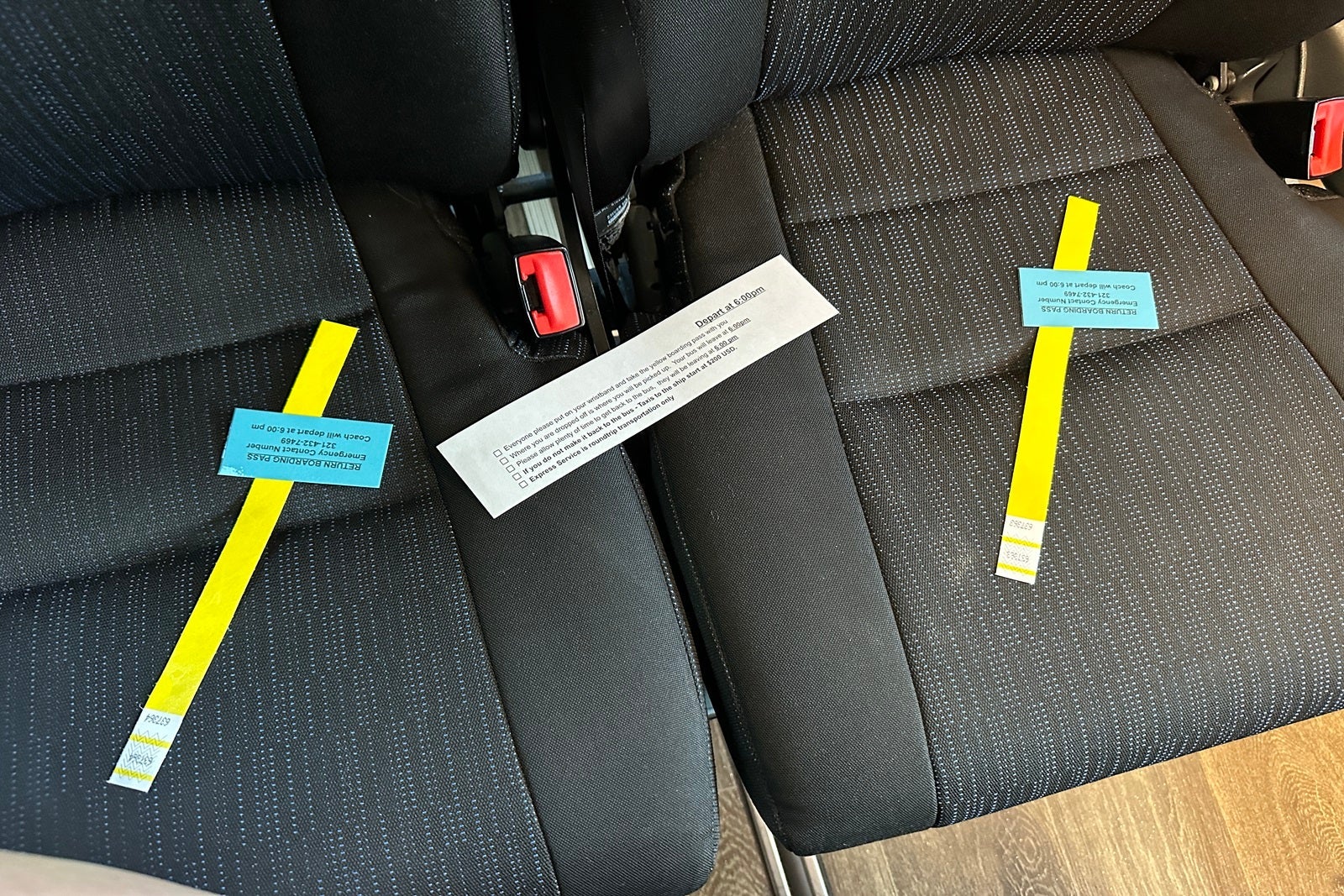 Bus seats with information and boarding passes on them