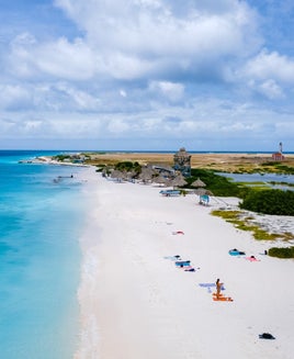 Klein Curacao Island with Tropical Beach at the Caribbean island of Curacao Caribbean, drone aerial view at a beach with turqouse colored ocean and people sunbathing