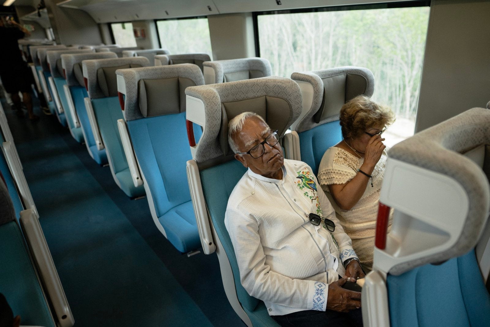 A man sleeps onboard the Mayan Train in Mexico, on April 18, 2024.