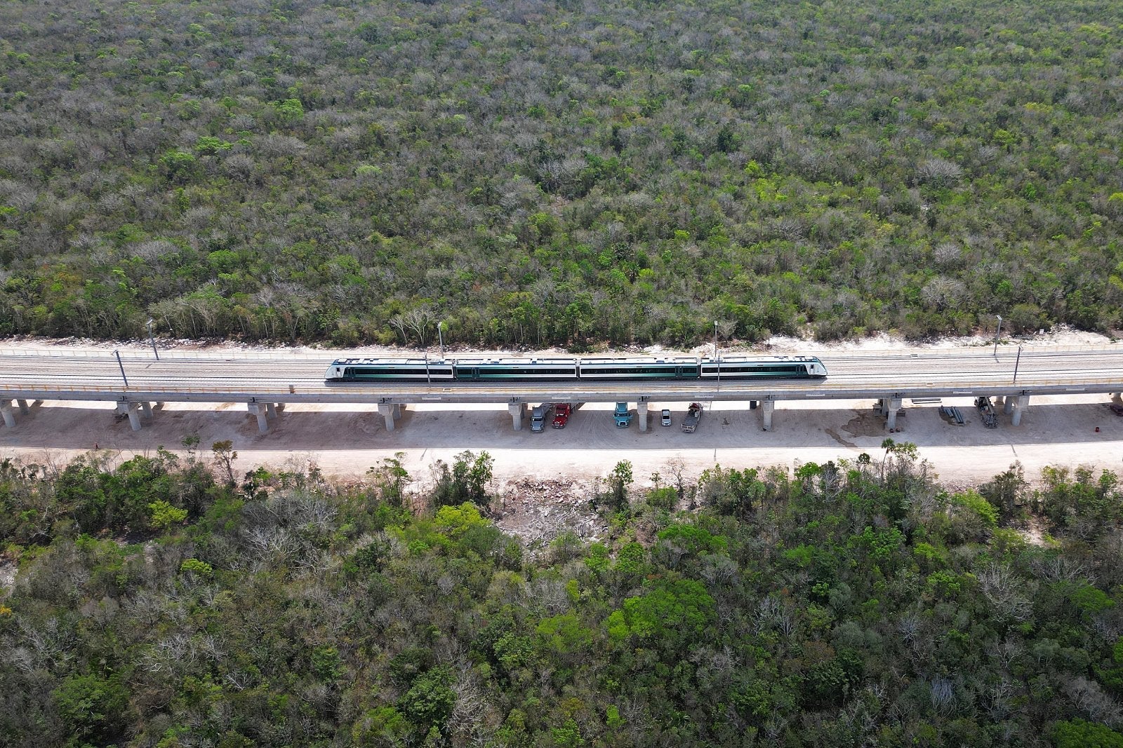 Aerial view of the Mayan Train leaving Puerto Morelos station in Mexico in April 2024.