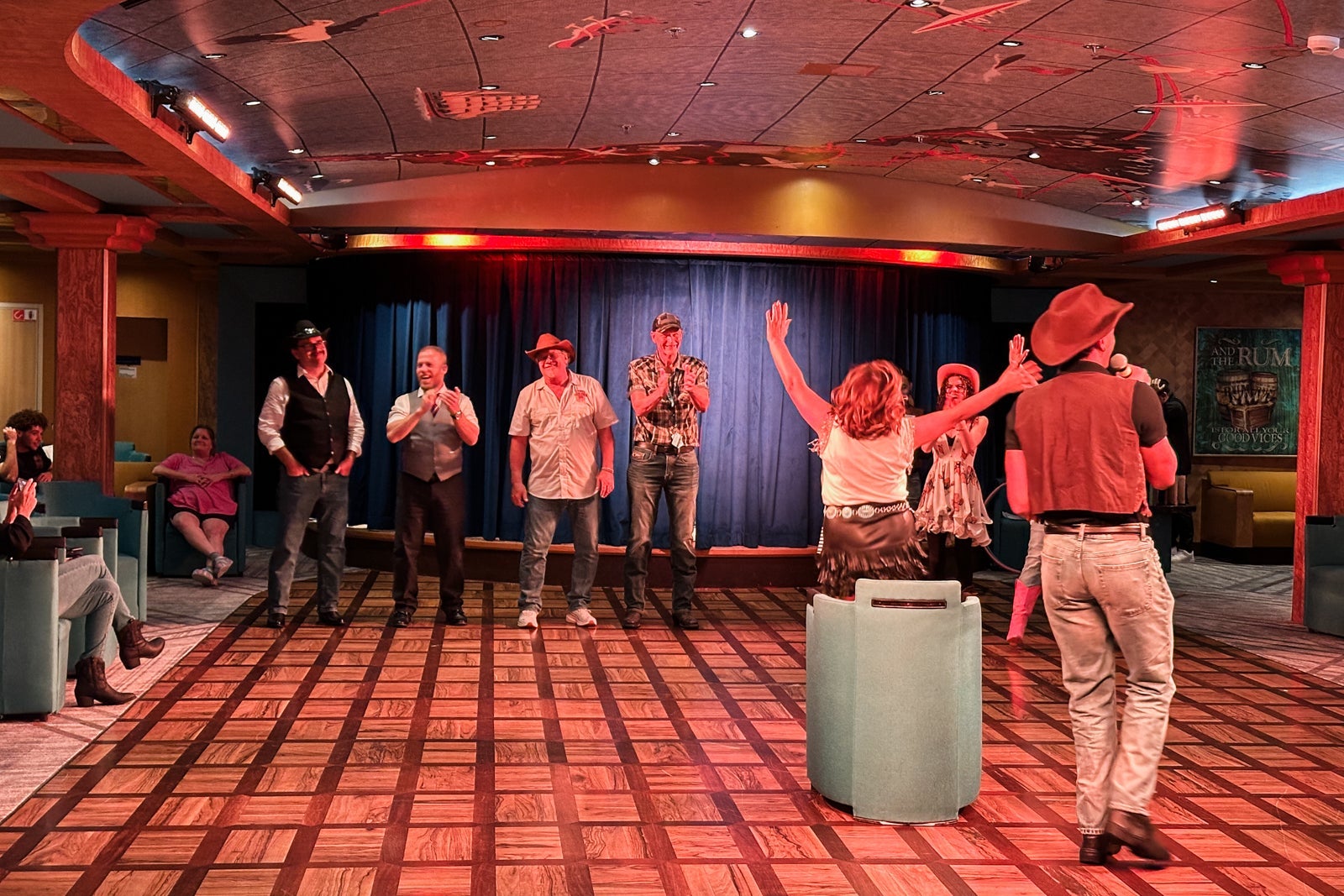 Passengers participate in a gameshow on a cruise ship