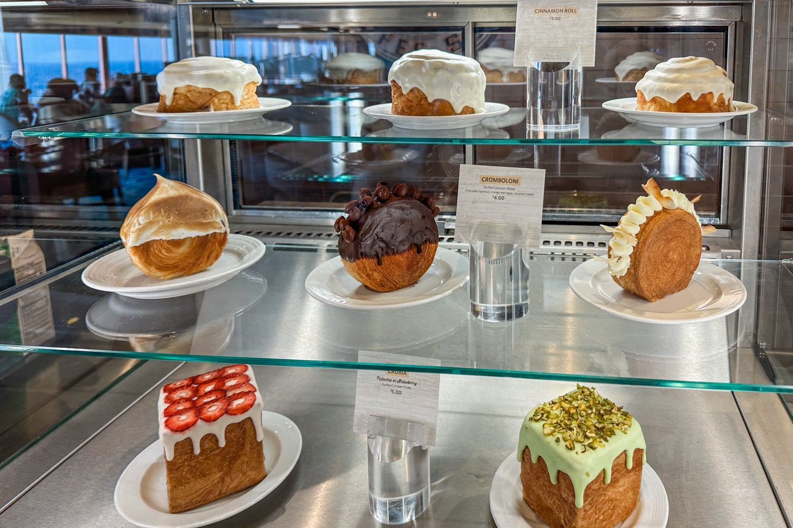 Pastries on glass shelves in a display case