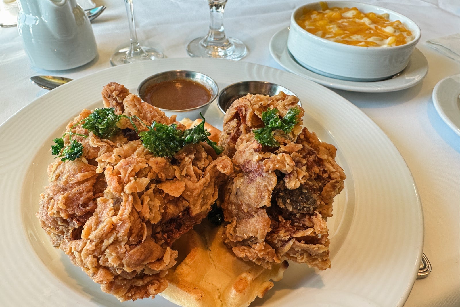 Chicken and waffles on a white plate