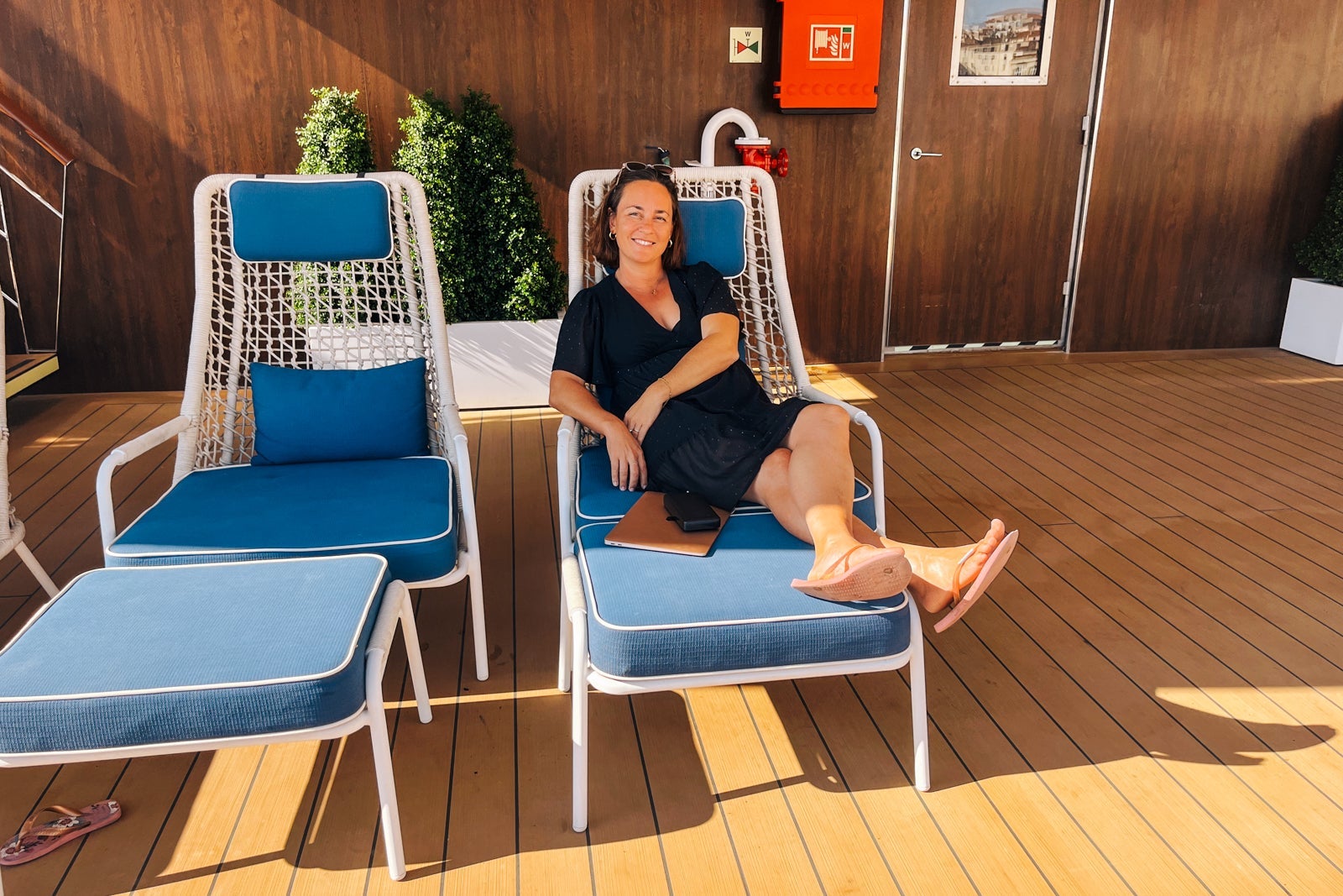 Woman reclining on cruise ship lounge chair