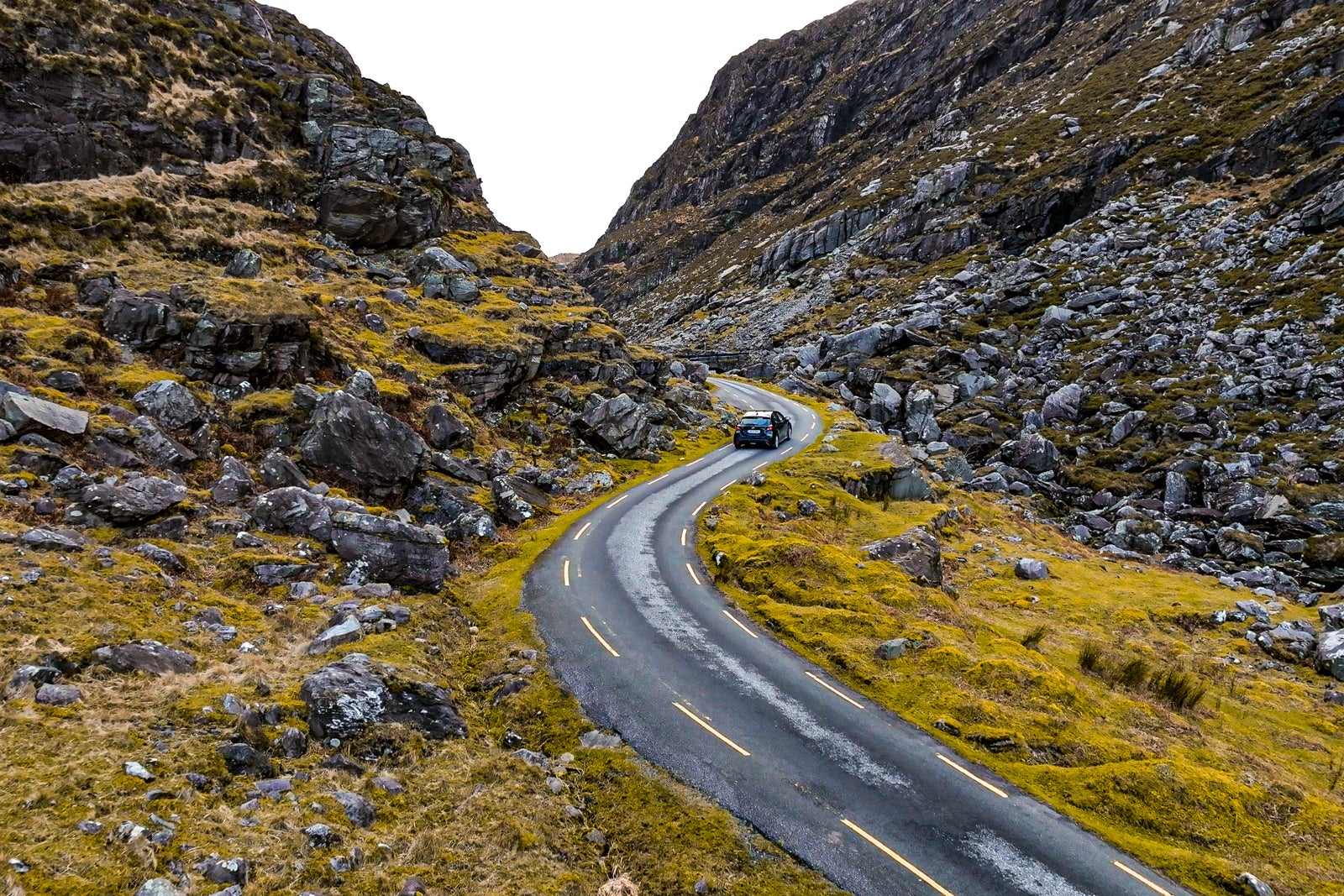 Aerial view of Gap of Dunloe, County Kerry in Ireland,Aerial view of scenic mountain pass, aerial nature and road view, aerial view of winding road, nature relax video, car driving the winding road between the mountain