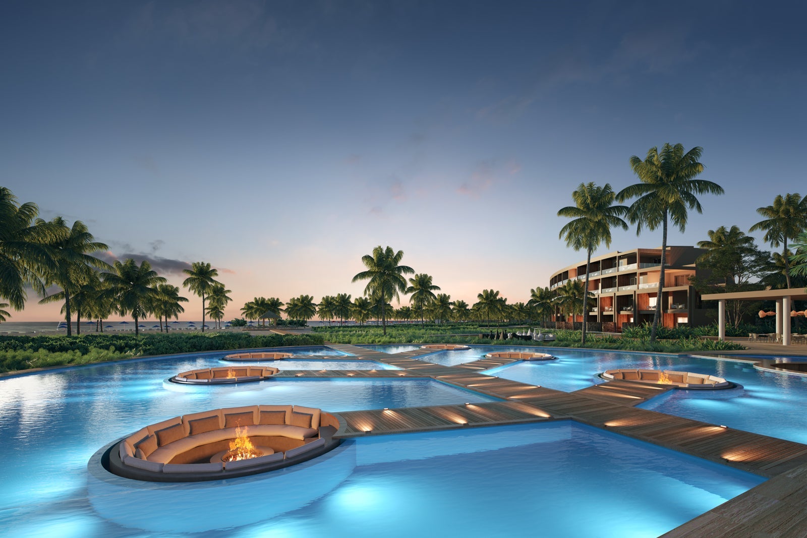outdoor pool and fire pits at sunset