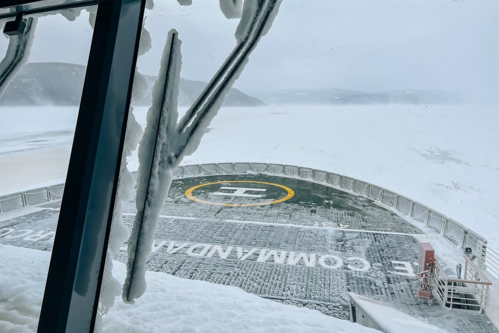 The view from the bridge as Le Commandant Charcot plows up the frozen Sanguenay Fjord.