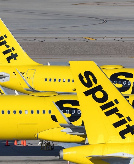 Three Spirit Airlines Airbus A320neo parked next to the terminal at Harry Reid International airpot in Las Vegas, Nevada.