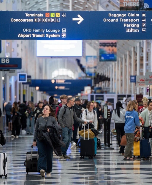 Travelers At ORD Airport Ahead Of Christmas Holiday