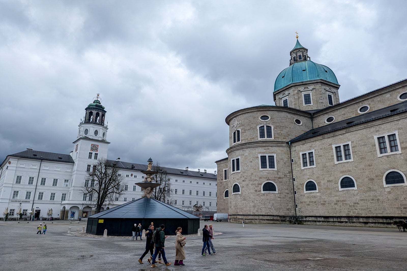 Empty plaza in Salzburg with boarded-up fountain
