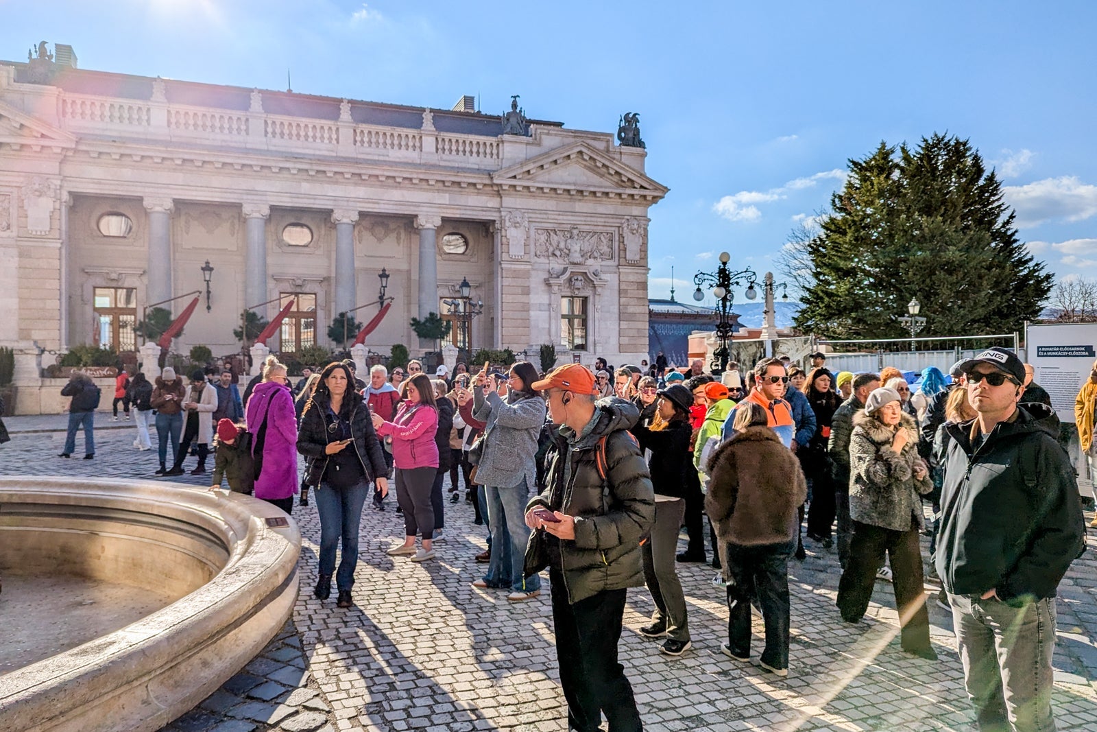 Crowds in front of historic buildings in Budapest