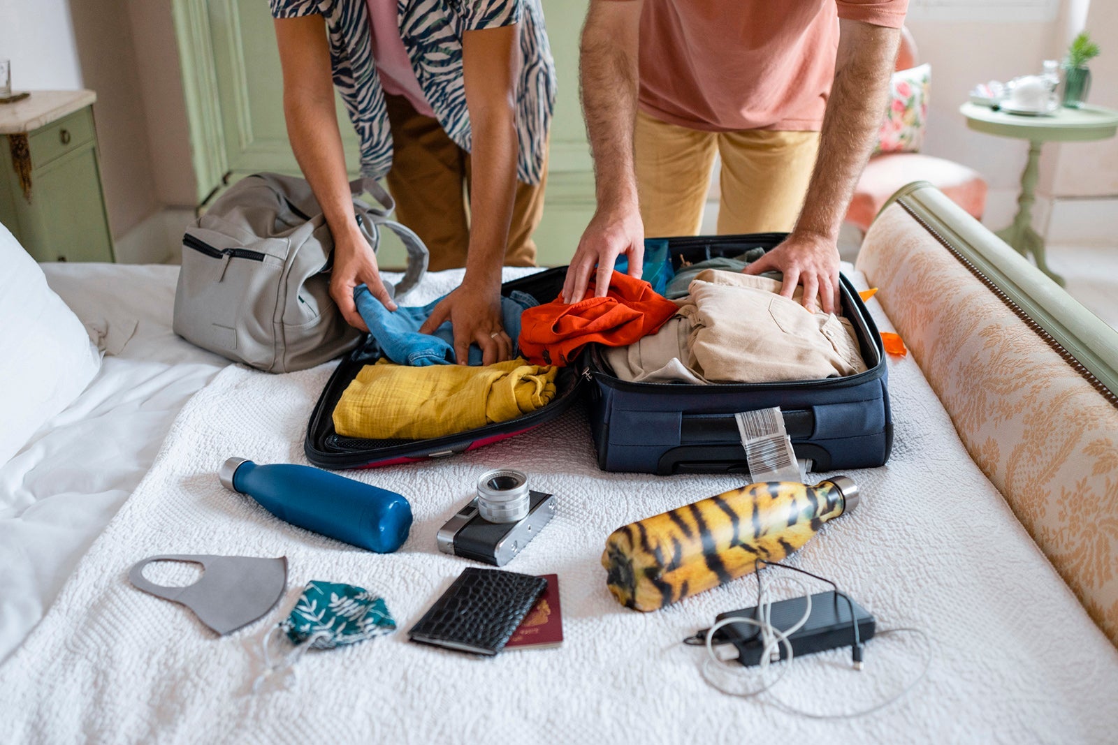 Couple packing for vacation