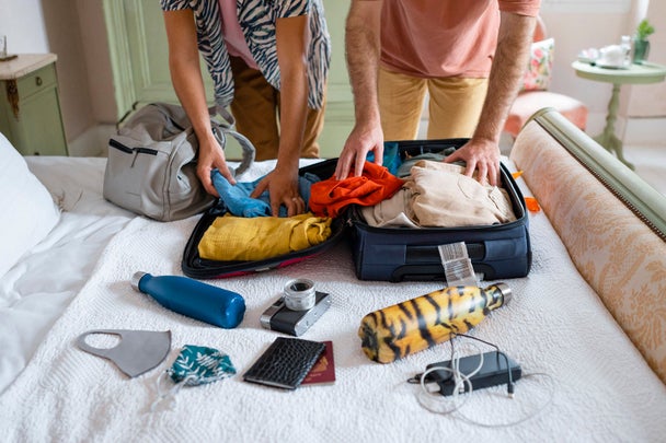 Gay Couple Packing Their Suitcase