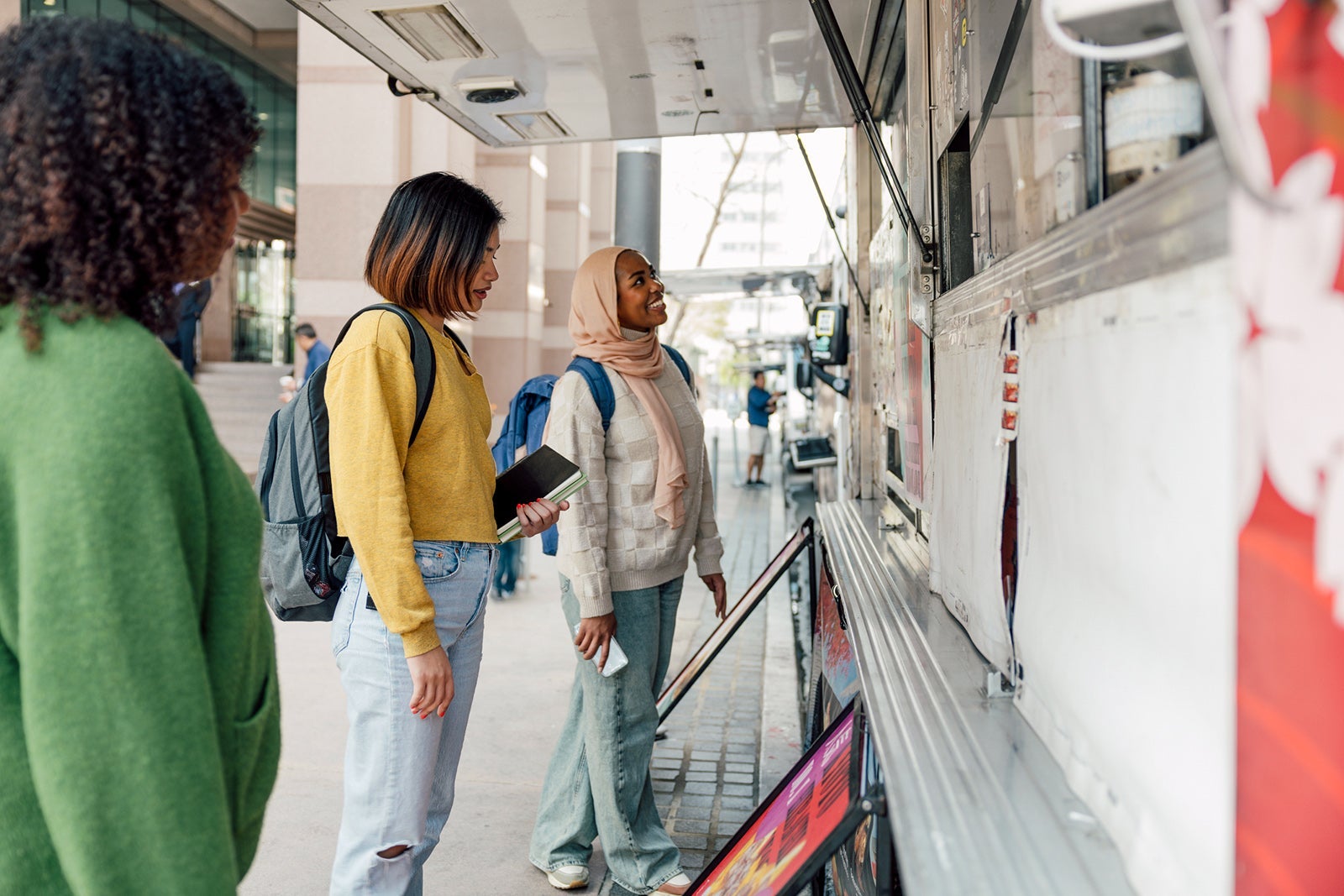 Friends ordering lunch at food truck