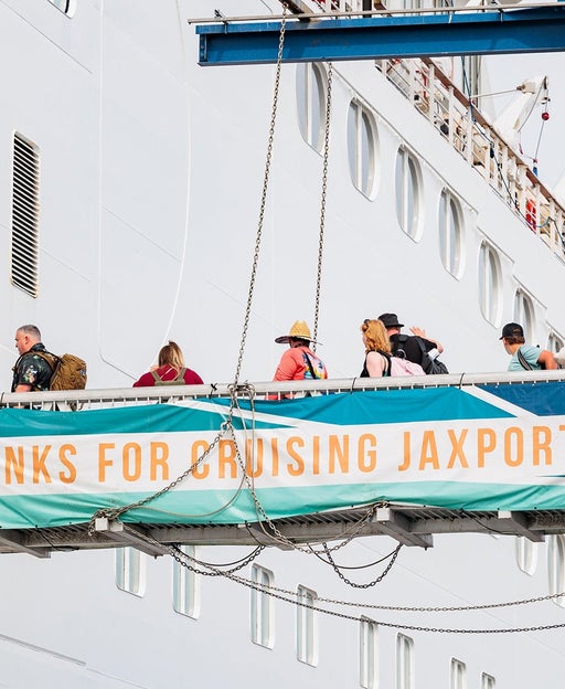 Cruise ship gangway with a sign saying "Thanks for cruising JAXport"