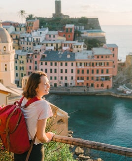 Woman looking at scenic view of Cinque Terre village in Italy