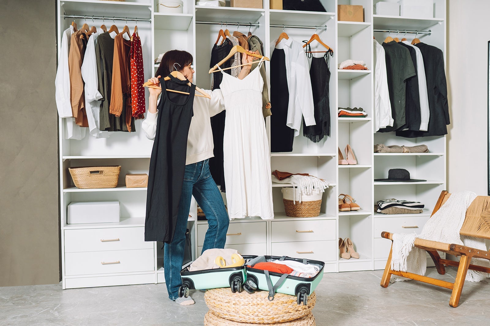 Woman choosing dressed to pack for a vacation