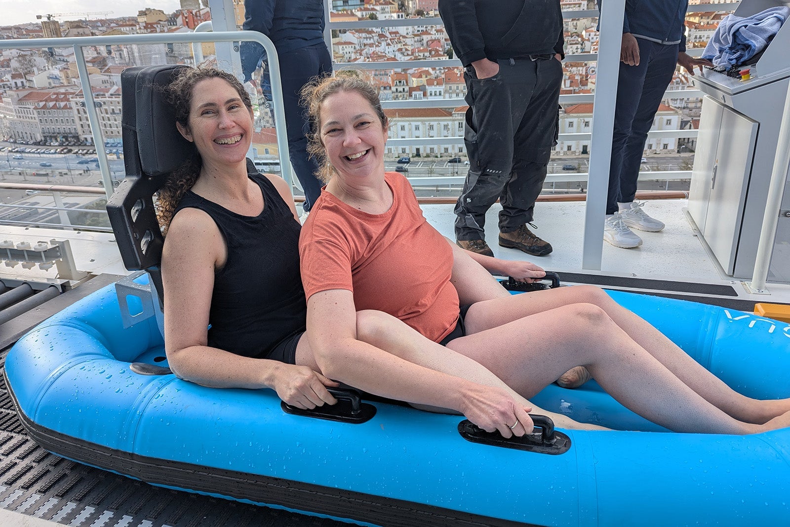 Two women in water ride raft